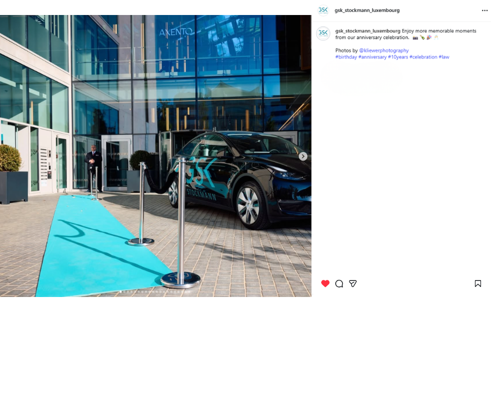 Photo of the GSK Stockmann branded car and teal carpet outside the office entrance during the anniversary celebration